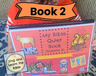 May include: A spiral-bound My Bible Quiet Book Volume II with a colorful cover featuring illustrations of a cow on a stone wall, a burning bush, a person in reeds, and a bearded figure. The cover includes the text Sing and Learn the Bible.