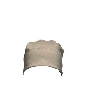 May include: A plain, light beige beanie hat.