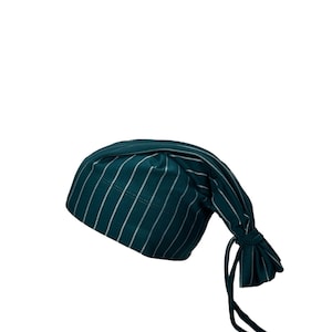 May include: A teal-colored sleep cap with vertical white stripes. The cap is tied at the end with long, dangling ties. The fabric appears to be soft and lightweight, suitable for sleepwear.