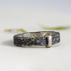 side view of the rustic hammered details in this handmade ring band.