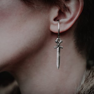 Photo shows the Ear cuffs accented with a sword charm. Charms are sold separately