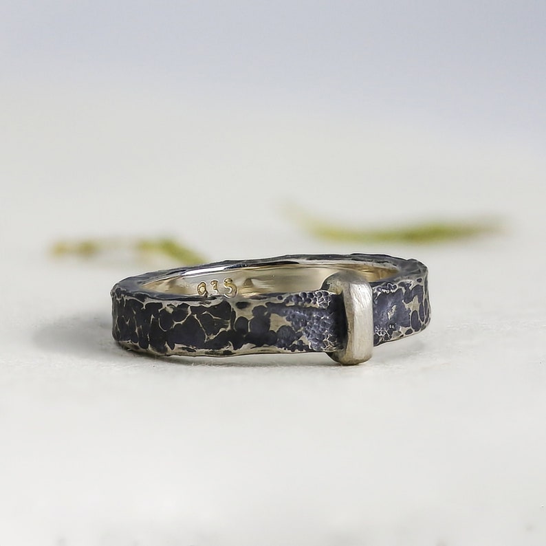 side view of the rustic hammered details in this handmade ring band.