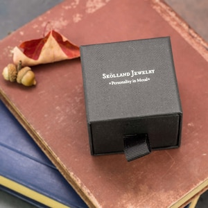 Black,branded skolland jewelry ring box that your ring will arrive in.