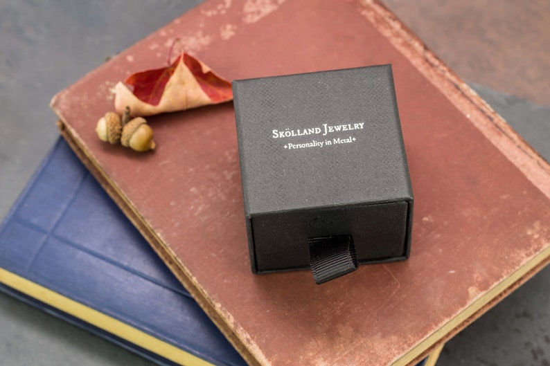 Black,branded skolland jewelry ring box that your ring will arrive in.