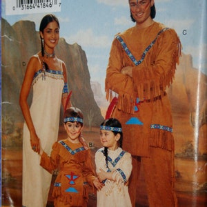 May include: Butterick BP209 sewing pattern featuring Native American-inspired costumes. The image shows a family dressed in tan-colored outfits with fringed details and decorative trim. The pattern includes options for adults and children.