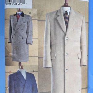 May include: A vintage Vogue Men's sewing pattern, V7988, featuring illustrations of men's overcoats and blazers. The pattern includes sizes 32-34-36. The image shows a tan overcoat and two blazer designs in gray and blue.