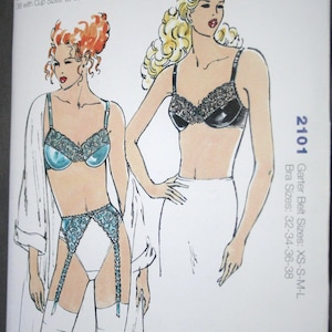 May include: Kwik Sew sewing pattern 2101 featuring illustrations of lingerie. The pattern includes bra sizes 32-38 with cup sizes A, B, C, D, and garter belt sizes XS-M-L. The cover art shows two women in lingerie.