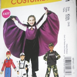 May include: McCall's Costumes pattern for kids aged 3-8. The image shows a child in a purple cape and other costume options, including a SWAT uniform, a race car driver, and an astronaut. The pattern is labeled "Easy".
