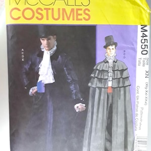 May include: McCall's Costumes sewing pattern for a historical costume. The pattern is for sizes XN (XIg-XXI-XXXI). The pattern includes a coat and a cape. The pattern is illustrated with a man wearing the costume.