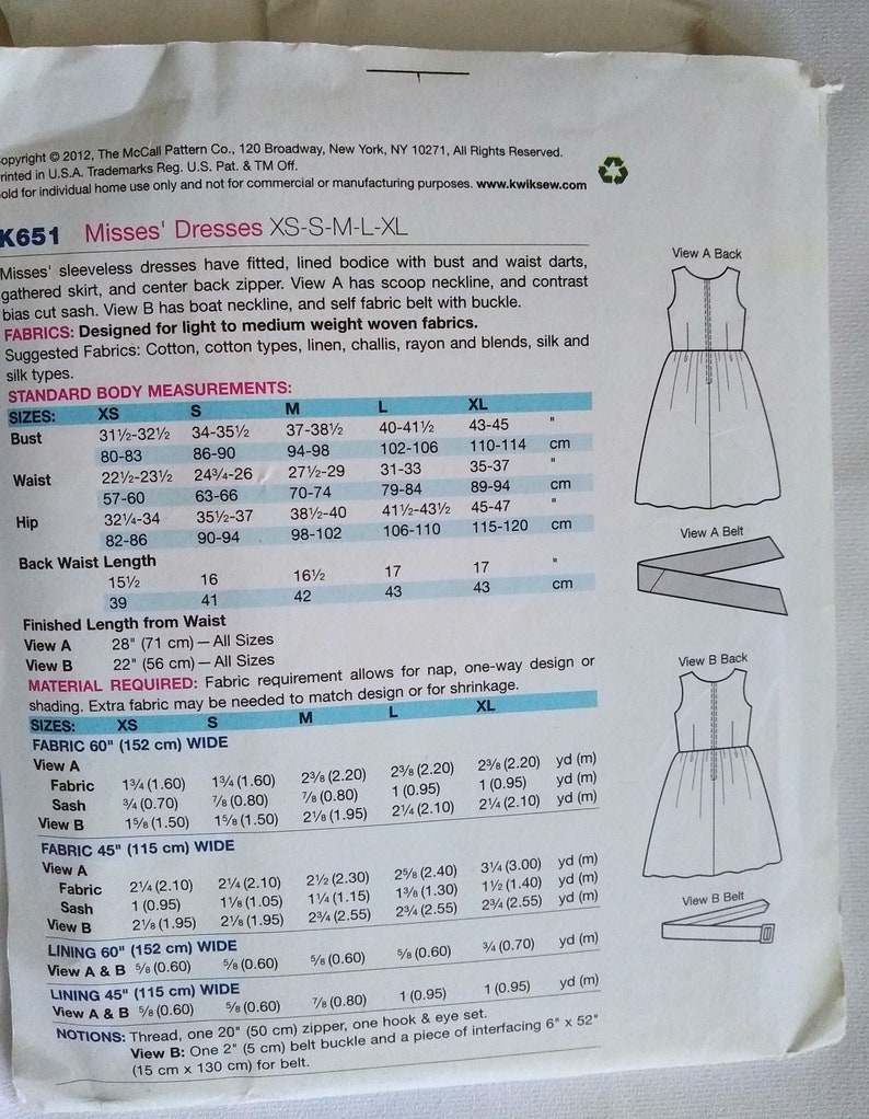 May include: Sewing pattern for misses' sleeveless dresses with fitted, lined bodice, bust and waist darts, gathered skirt, and centre back zip. View A has scoop neckline and contrast bias cut sash. View B has boat neckline and self fabric belt with buckle. Fabric requirements are listed for sizes XS, S, M, L, and XL. The pattern is for light to medium weight woven fabrics.