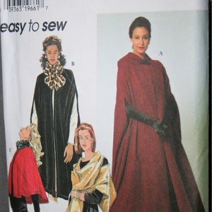 May include: Simplicity sewing pattern number 7438 for a hooded cape. The pattern includes four different styles, with one style featuring a leopard print collar. The pattern is for sizes XS, S, and M.