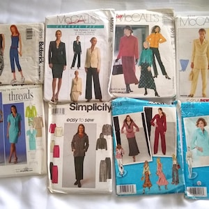 May include: A collection of vintage sewing patterns featuring various designs for suits, dresses, and separates. The patterns showcase illustrations of the finished garments, with brands like McCall's, Butterick, Simplicity, and Threads.