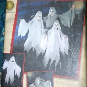 May include: Simplicity pattern 2486 featuring a Halloween ghost costume. The cover art shows multiple images of ghostly figures in flowing white fabric with eerie makeup. The pattern includes sizes A, S-M-L, and EUR P-M-G.