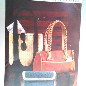 May include: Vogue accessories pattern featuring three bag designs: a woven tote, a coral-colored handbag with braided handles and tassels, and a small blue clutch. The pattern number is V7948.