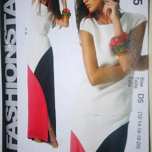 May include: A McCall's M6755 sewing pattern envelope for a color-blocked dress featuring a white bodice and a skirt with black and red diagonal panels. The packaging displays the text Fashion Star, Easy, and size range D5 12-14-16-18-20.