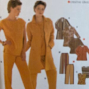 May include: A sewing pattern featuring two women modeling mustard-colored outfits: a sleeveless top and pants, and a long coat with pants. Additional garment designs include a jacket, skirt, and top. The pattern is labeled "PLUS" with size information.
