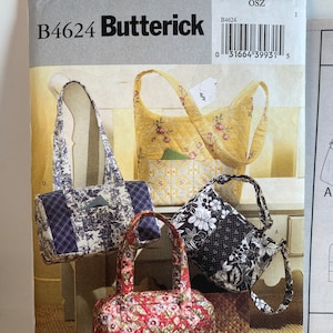 May include: A sewing pattern for four different bags. The pattern is called Butterick B4624 and is for one size. The bags are all quilted and have different floral patterns. The bags are shown on a white background.