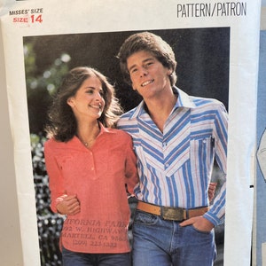 May include: A vintage sewing pattern featuring a couple wearing casual clothing. The man is wearing a blue and white striped shirt with a brown belt and blue jeans. The woman is wearing a pink shirt with blue jeans. The pattern number is 5301 and the price is $1.75. The pattern is for misses' size 14.