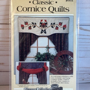 May include: A sewing pattern for a cornice quilt, featuring a floral design with red, green, and brown accents. The pattern is titled "Classic Cornice Quilts" and includes instructions for making two valances and curtains. The pattern is from Donna Gallagher, Creative Needlearts, Inc.