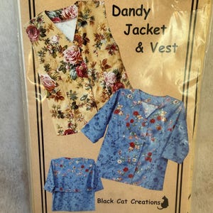 May include: A sewing pattern envelope titled Dandy Jacket & Vest by Black Cat Creations. The cover displays a tan vest with a red and pink rose floral print, and a blue jacket with a small red and white floral pattern, shown front and back.