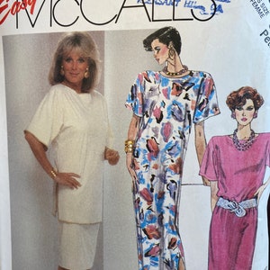 May include: A sewing pattern for a dress with three different styles. The pattern is from McCall's and is designed by Linda Evans. The dress is shown in three different colors: white, blue with a floral print, and pink.