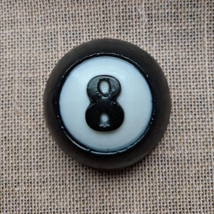 This glycerin and activated charcoal soap is perfect for the billiards player in your life. It is the eight ball, or at least most of it because the back is flat so that the soap will not roll away in the shower. Pick your favorite fragrance.