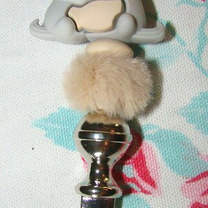 light gray otters letter opener desktop accessory