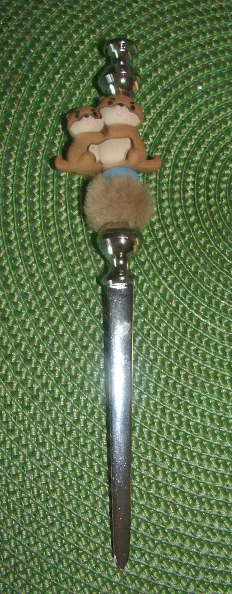 otter letter opener
featuring mama and baby otter papa and baby otter