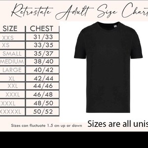 The image is a size chart for adult-sized t-shirts, displaying the sizes of various t-shirt styles in inches and centimeters.
