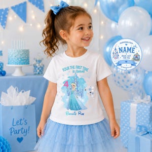 May include: A white short-sleeved t-shirt featuring a graphic of a blonde character in a blue gown standing before a castle. The text reads "FOUR THE FIRST TIME in forever" and "Bonnie Rae" with a large pink number 4. The shirt is worn with a blue tulle skirt.