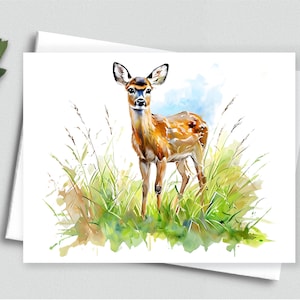 May include: Watercolor painting of a deer standing in tall grass. The deer has brown fur with white spots and large ears. The background features a blue sky and green grass, creating a natural scene. The artwork is on a white card.