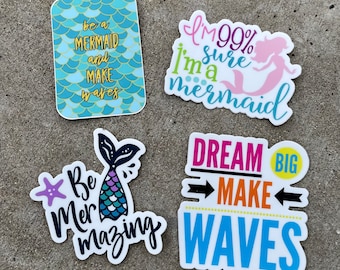 May include: Four colorful stickers with mermaid-themed designs. The stickers feature the text "be a mermaid and make waves", "I'm 99% sure I'm a mermaid", "Be Mermazing", and "Dream Big Make Waves".