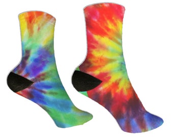 May include: Two colorful tie-dye socks. One sock features a vibrant mix of yellow, blue, and green, while the other showcases red, yellow, and orange hues. Both socks have black heels and toes, and white trim at the top.
