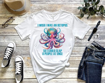 May include: White t-shirt with a colourful octopus graphic and the text "I wish I was an octopus so I could slap 8 people at once." The octopus design features vibrant hues of blue, purple, and pink.