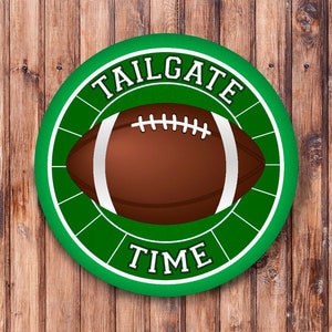 May include: A green circle with a white border and the text "TAILGATE TIME" in white. A brown football with white laces is in the center of the circle.