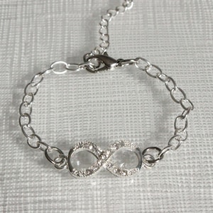 Silver Chain and Rhinestone Encrusted Infinity Charm Bracelet