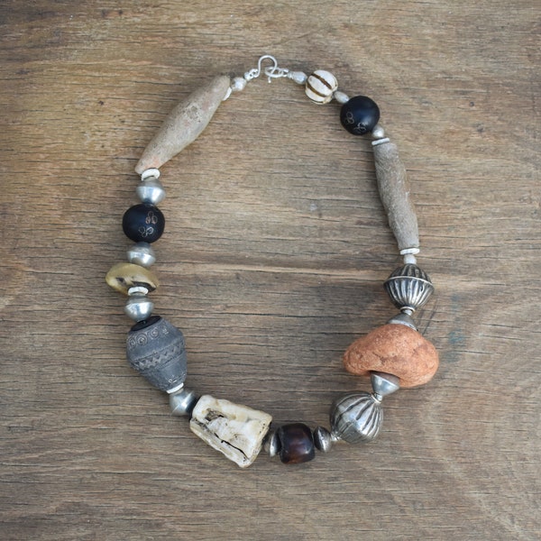 Trade bead necklace with Togo thunderstone, Muria silver, Mali spindle and Dogon clay