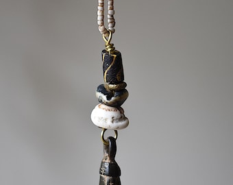 Collar con colgante de Burkina Faso y concha de Naga.