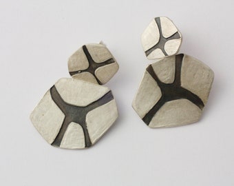 Articulated earrings. Long earrings with relief that forms an abstract pattern. Organic silver earrings, irregular shape.