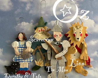 OZ Ornaments-Dorothy+Toto,Scarecrow,Tin Man,Lion,Wicked Witch,Glinda,Flying Monkey,House,Emerald City and * New for 2026The Wizard!