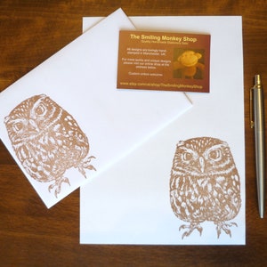 May include: Two white envelopes with a brown owl illustration printed on them. The envelope on top has a business card with the text "The Smiling Monkey Shop" and the website address "www.etsy.com/uk/shop/TheSmilingMonkeyShop".
