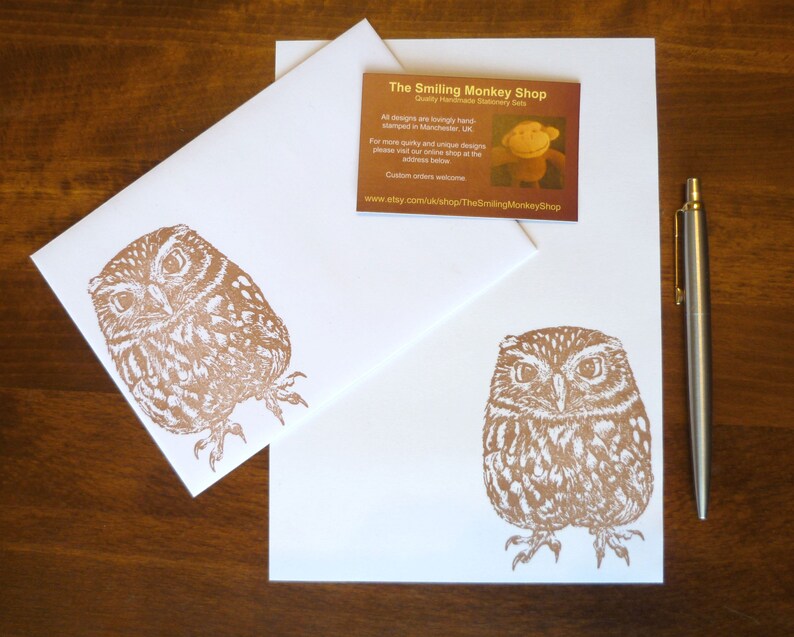 May include: Two white envelopes with a brown owl illustration printed on them. The envelope on top has a business card with the text "The Smiling Monkey Shop" and the website address "www.etsy.com/uk/shop/TheSmilingMonkeyShop".