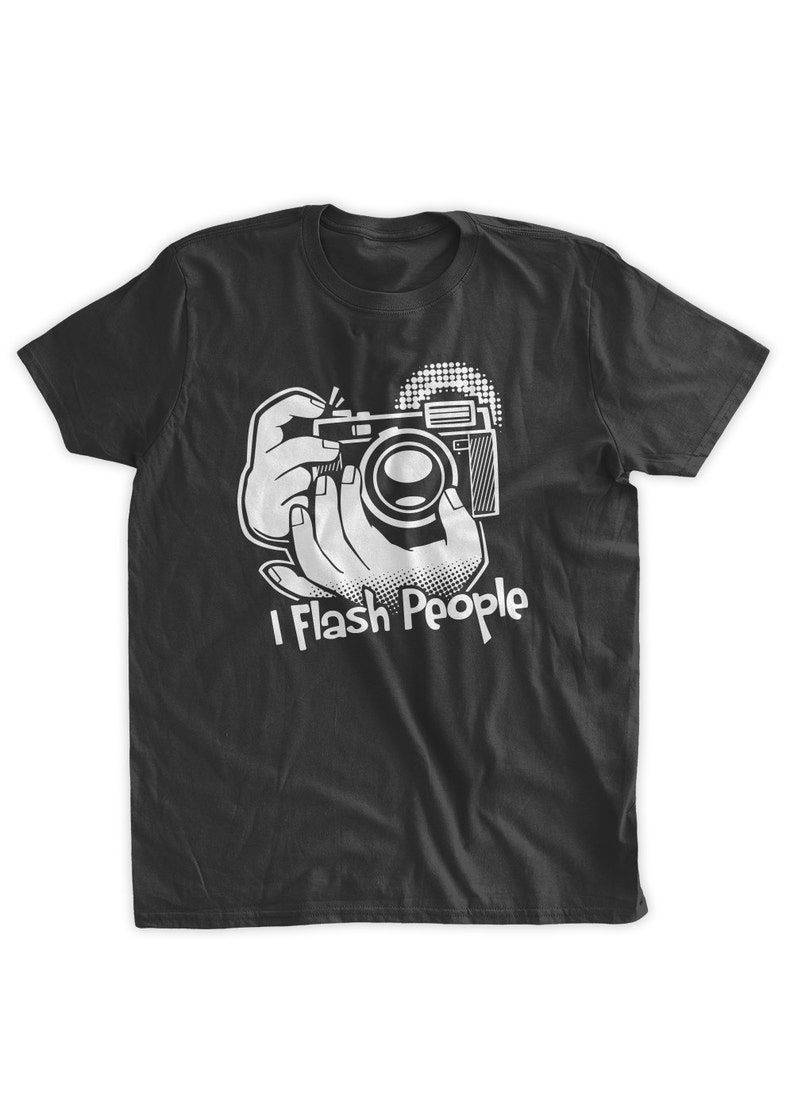 May include: Black t-shirt with a white graphic of a hand holding a camera and the text "I Flash People".