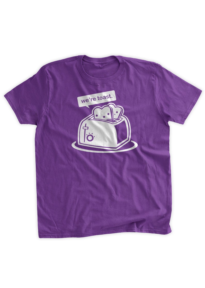 May include: Purple t-shirt with a white graphic of a toaster with two slices of bread inside. The text "we're toast." is above the toaster.