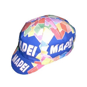 May include: A blue cycling cap with a colorful geometric pattern and the word "MAPEI" repeated on the front and side.