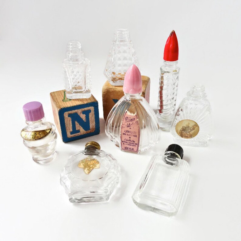 little dolls in perfume bottles
