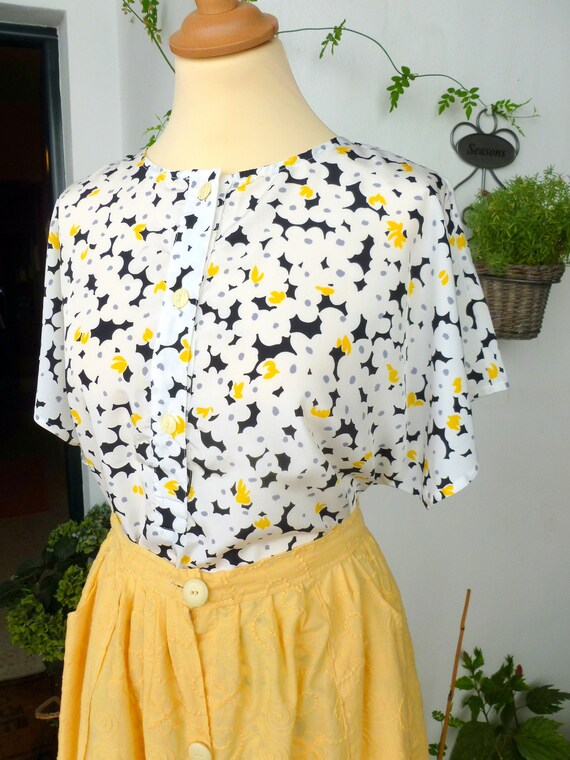 white top with yellow flowers