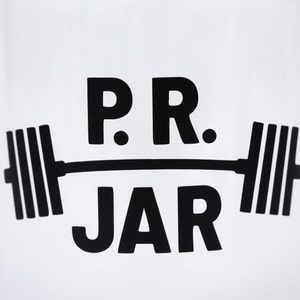 Close up of the PR Jar design in black on clear jar.