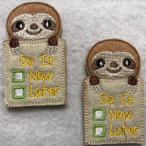 May include: Two felt sloth finger puppets holding signs that say "Do It Now" and "Do It Later". Each sign has two checkboxes, one checked and one unchecked.
