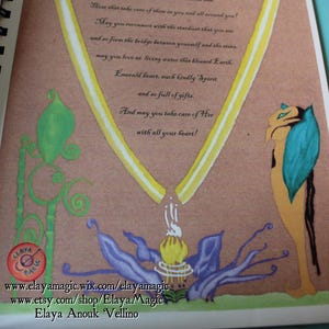 May include: A page from a book with a yellow and white ribbon design. The page has a handwritten message about embracing life and connecting with the elements. The text reads: "A Prayer, Elevation A - May you bless water, may you bless fire, may you bless air, may you bless earth. May you embrace all life in your wings of Love of Dream Fire. May you welcome the Elements and those that take care of them in you and all around you! May you reconnect with the stardust that you are and so form the bridge between yourself and the stars. May you love as living water this blessed Earth. Emerald heart, such kindly Spirit and so full of gifts. And may you take care of Her with all your heart!"